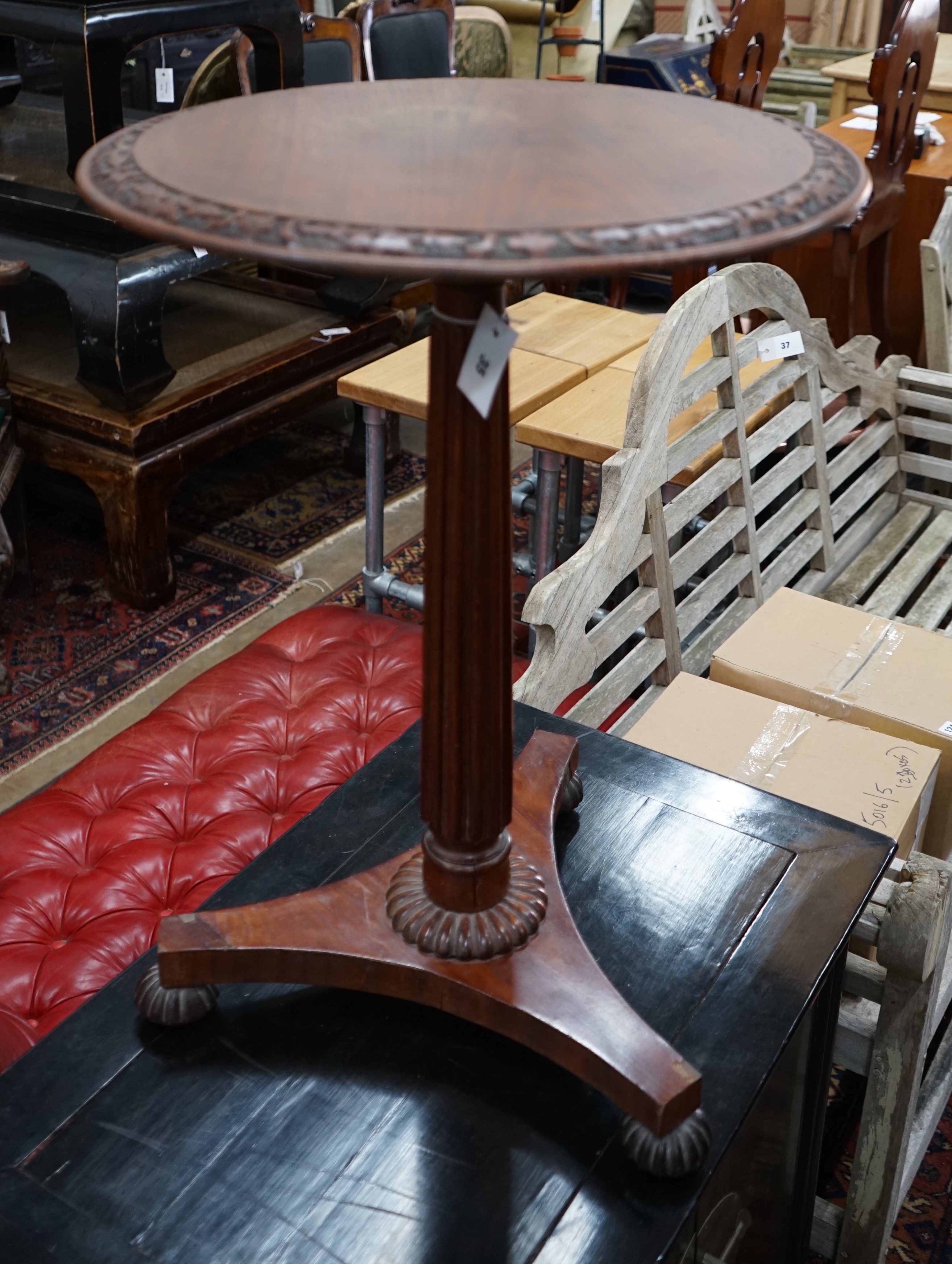 A Gillows style circular mahogany wine table, diameter 50cm height 71cm